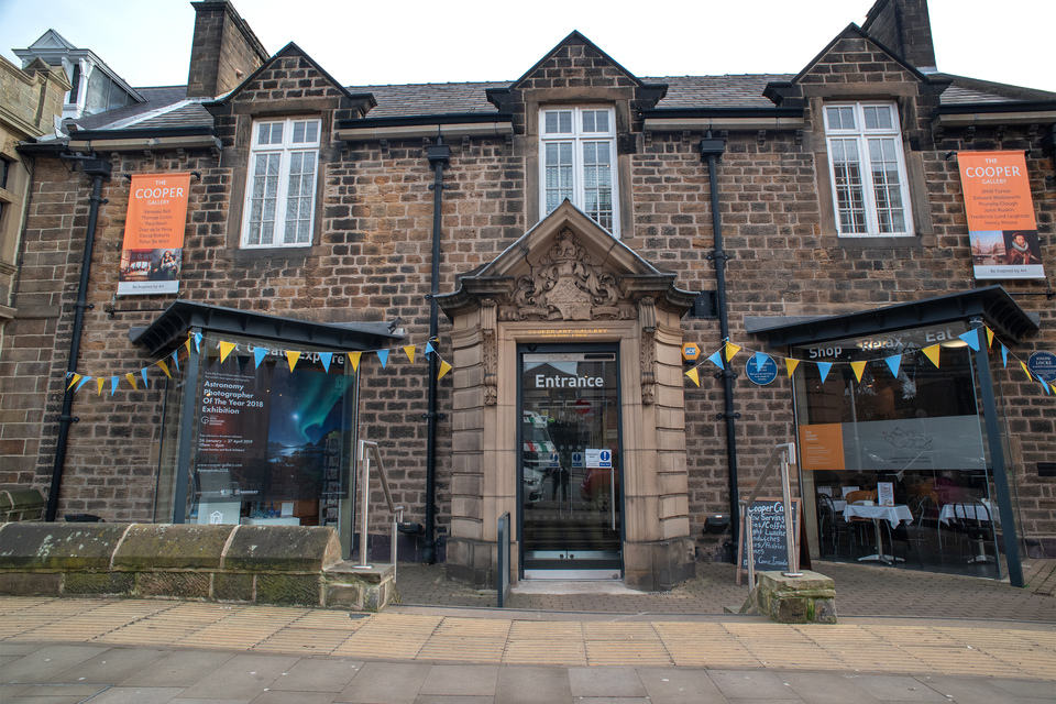Exterior of Cooper Gallery showing entrance door and windows